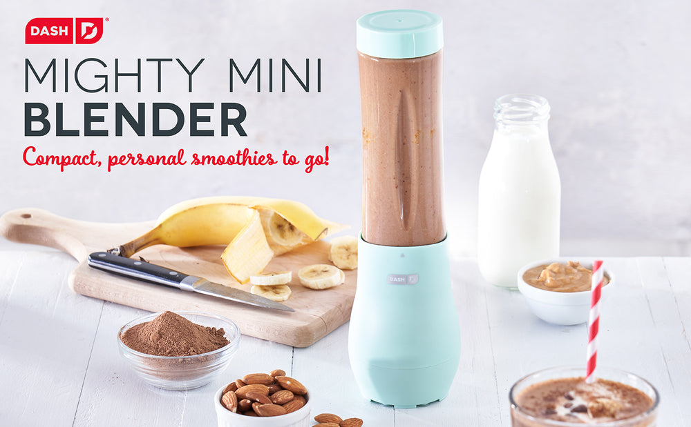 An aqua colored blender blending up a banana, chocolate, almond smoothie.