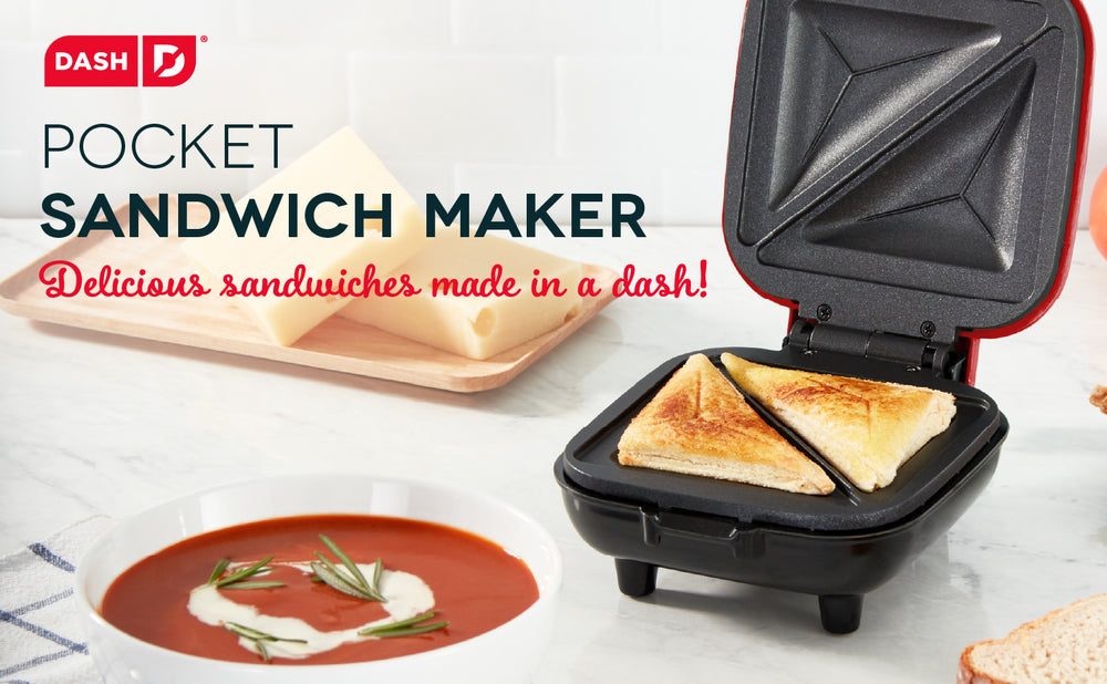 A fresh grilled cheese sits in the Pocket Sandwich Maker next to a bowl of tomato soup.