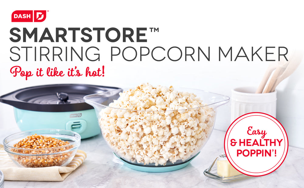 A big fresh bowl of popcorn next to the popcorn maker.