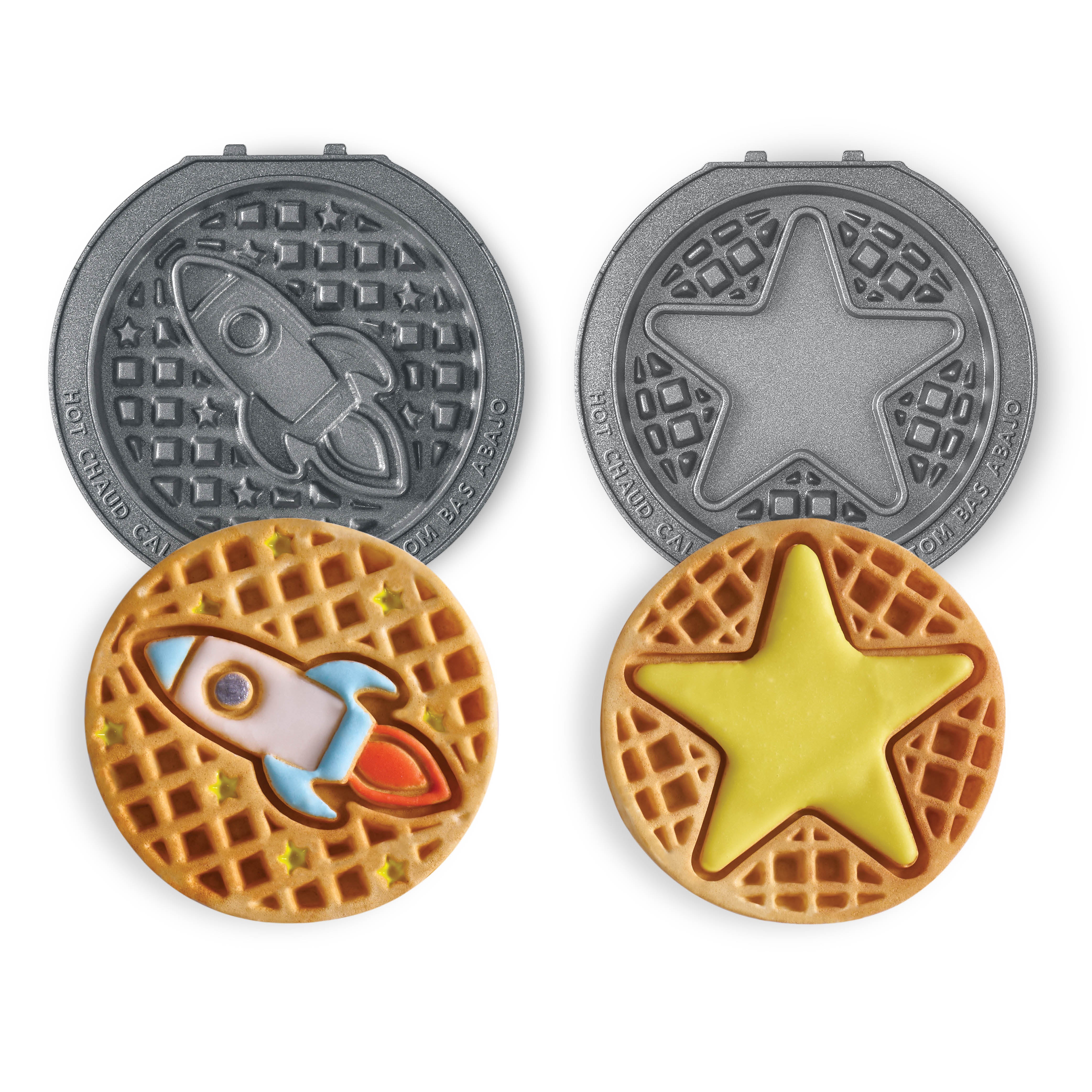 Red waffle maker with interchangeable festive plates and patterned waffles.