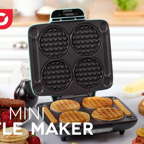 Waffle batter is added to the maker and cooked to make four mini waffles and two waffle sticks.
