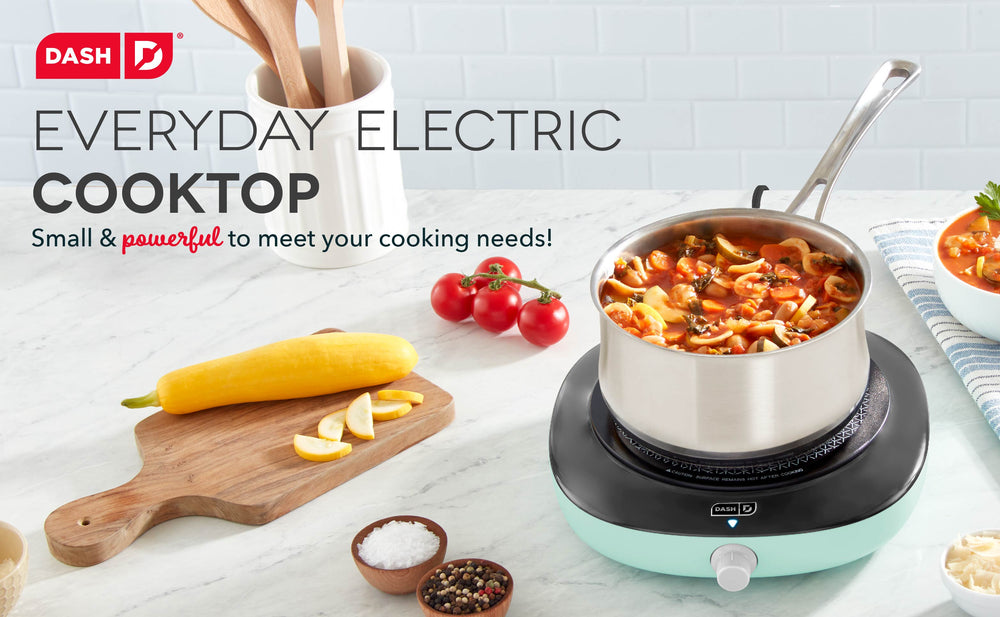 A blue Everyday Electric Cooktop cooks a vegetable soup.