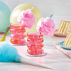Pink ribbed cups with straws decorated with cotton candy