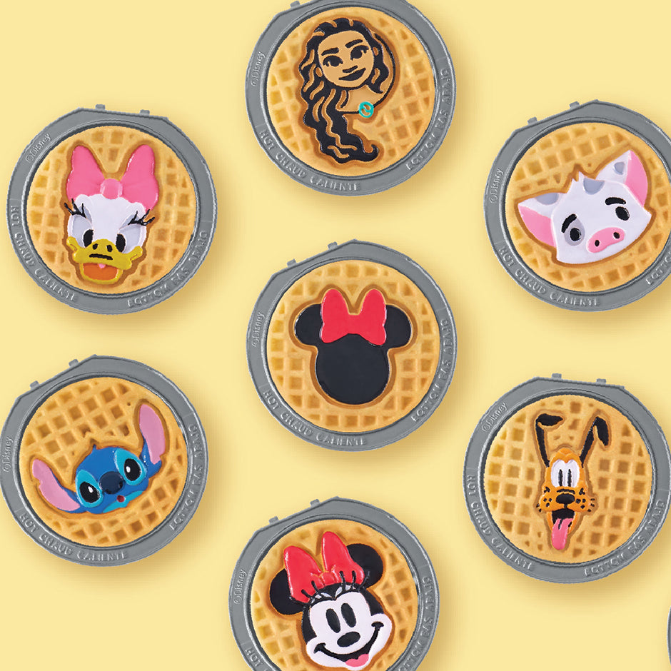 Waffle maker with Disney character designs on a yellow background