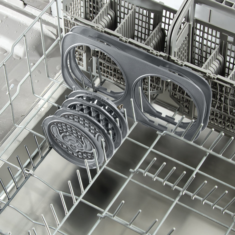 Removable Disney | Dash Stitch Waffle Maker plates loaded in dishwasher for easy cleanup and convenience.
