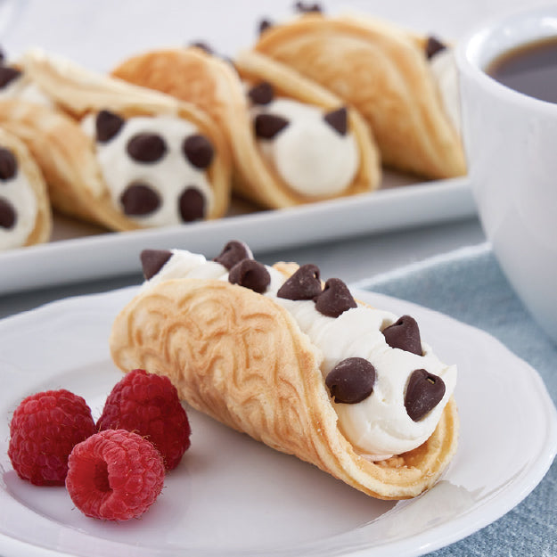 Crispy pizzelle cannoli filled with cream and chocolate chips made with the Dash Mini Pizzelle Maker.