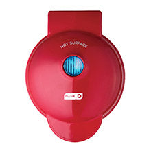 Red waffle maker with 'Hot Surface' warning on a white background