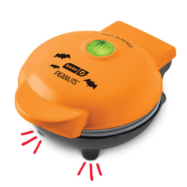 Orange waffle maker with 'Dash' branding on a white background
