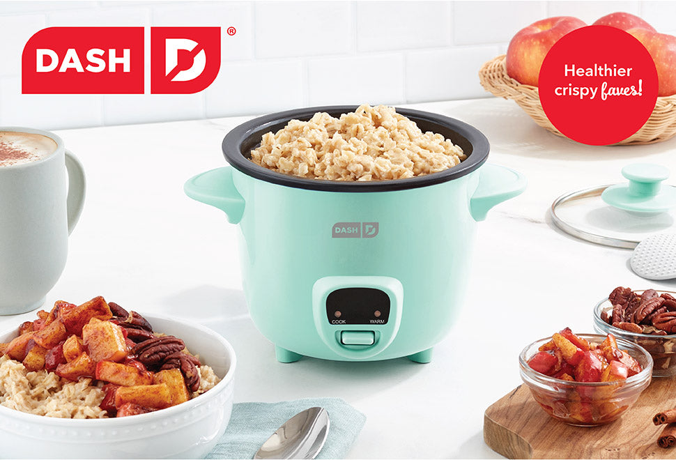 An aqua colored Mini Rice Cooker brimming with white rice.