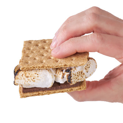Hand holding a s'mores snack with graham crackers and marshmallow on a white background