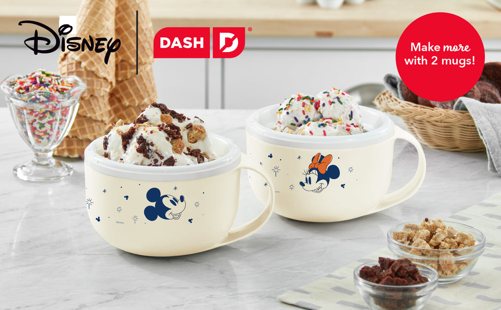 Two Disney-themed mugs filled with ice cream on a table with ingredients and a 'Dash' logo.