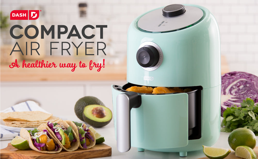 A blue Compact Air Fryer sits ajar holding ingredients for homemade tacos next to the tagline, “A healthier way to fry!”