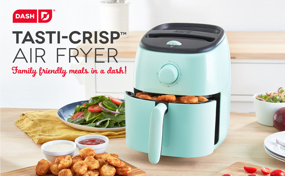 An aqua colored Air Fryer sits ajar holding fresh home fries for a tasty meal.