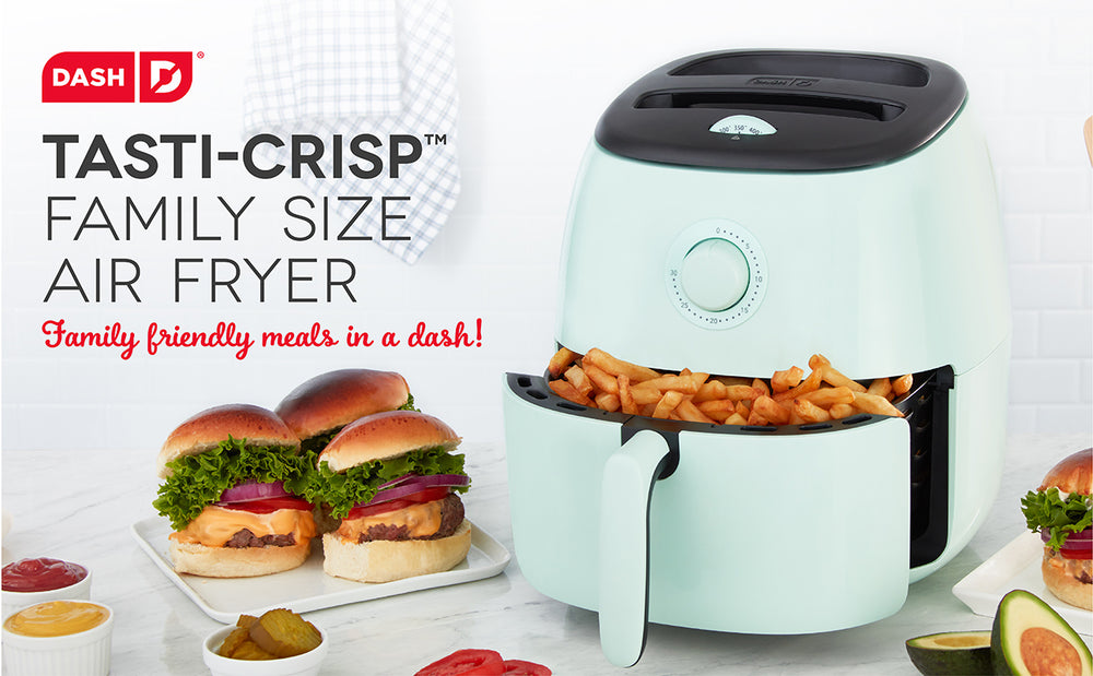 An aqua colored Air Fryer sits ajar holding fresh french fries for a family friendly burger dinner.