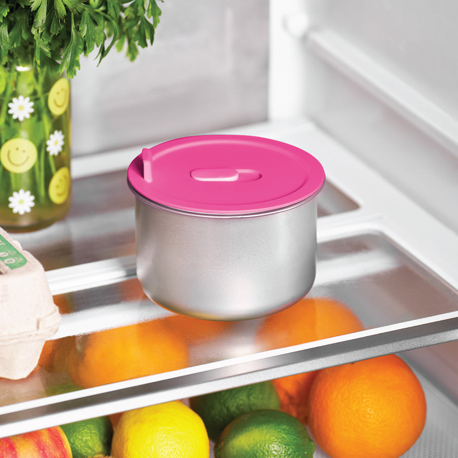 Dash Hot2Go™ Electric Lunchbox container with pink lid stored in refrigerator for easy meal prep and storage.