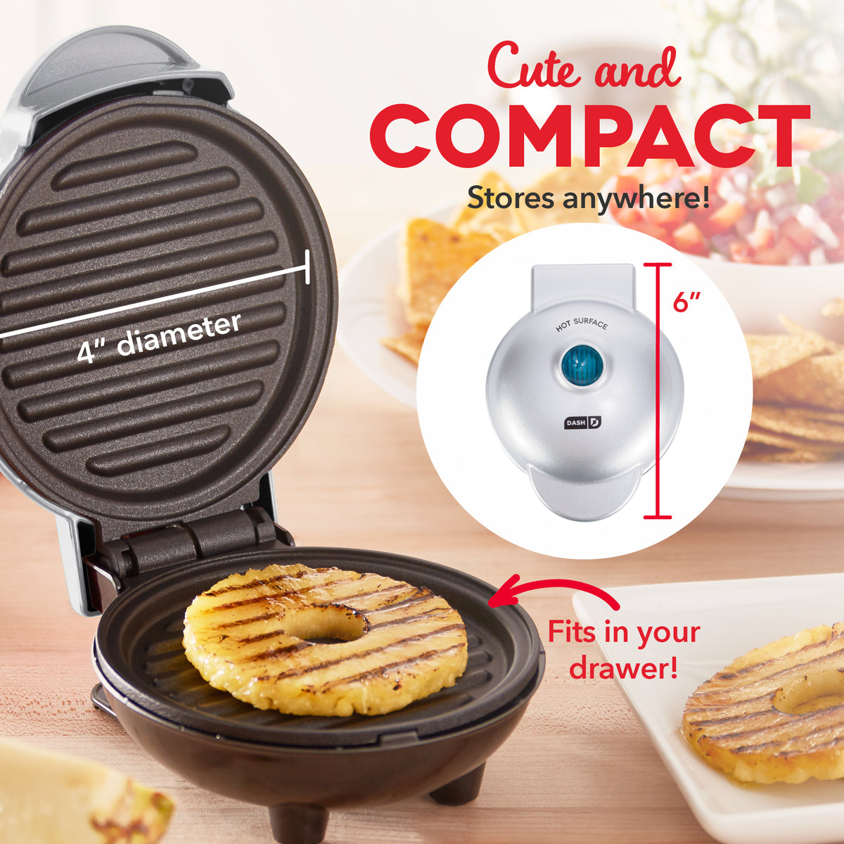 Compact brown grill with 4" diameter cooking surface, white control unit with blue power button, grilling corn patty.