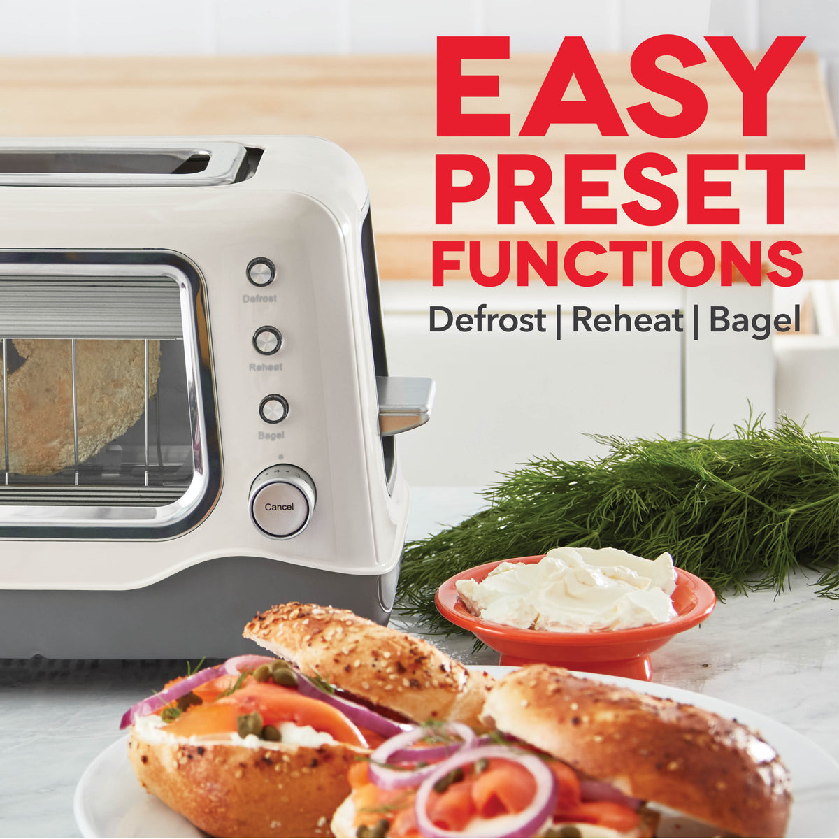 White toaster with clear viewing window, control buttons labeled Defrost, Reheat, and Bagel, displayed with bagels and cream 