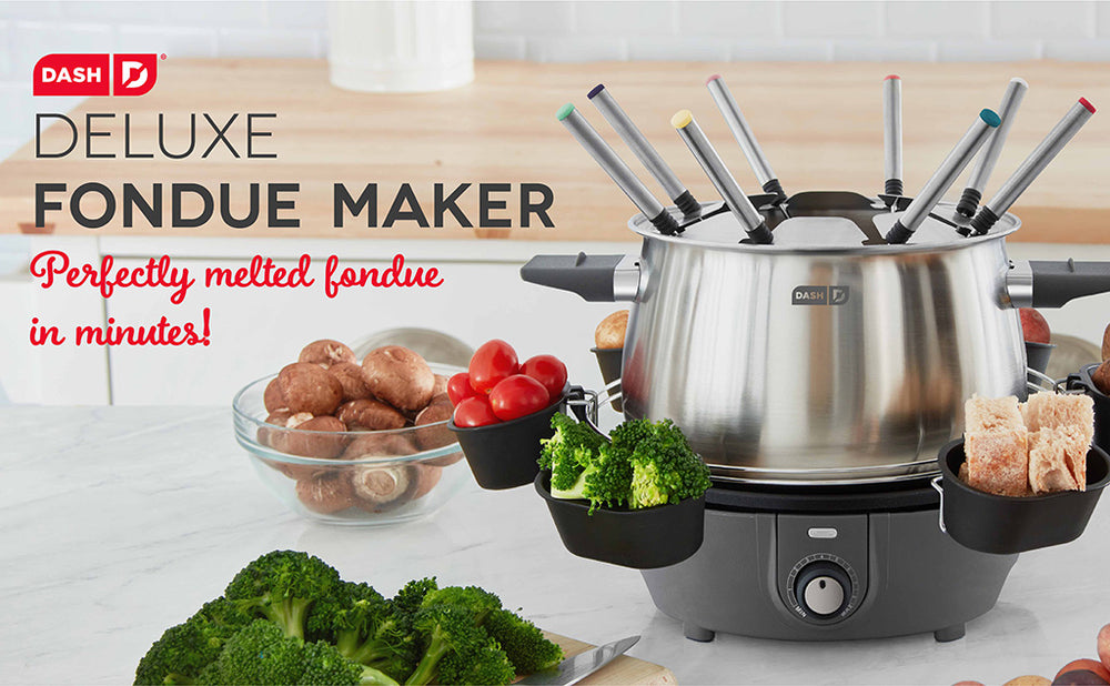 The Deluxe Fondue Maker on a countertop with mushrooms, broccoli, and bread for perfect fondue that's ready in minutes.