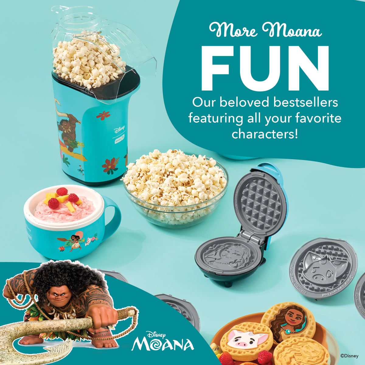 Turquoise popcorn maker with character graphics, filled with popcorn, displayed with matching bowl, mug, waffle maker, and bo