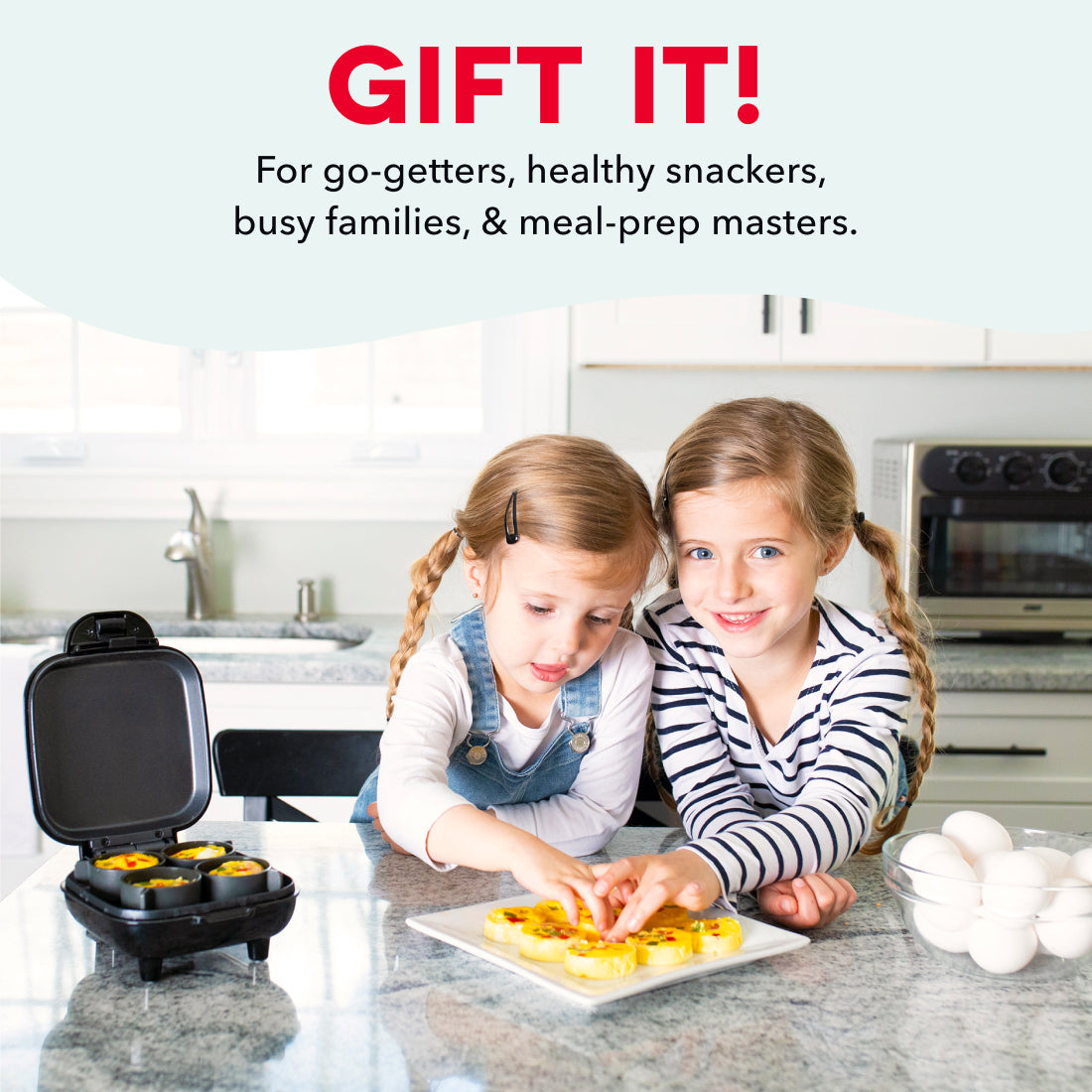 Black waffle-style egg bite maker with two children preparing cooked egg portions on a kitchen counter.