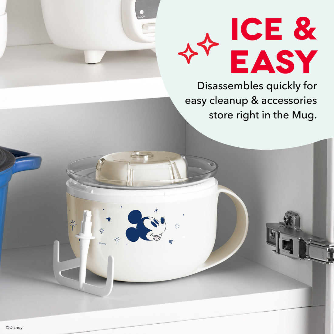 White mug-style ice cream maker with Mickey Mouse graphic and removable lid, displayed with machine unit above.
