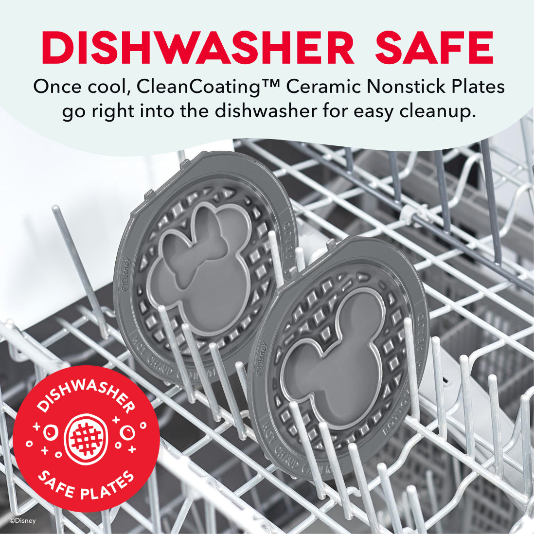 Two gray ceramic nonstick waffle plates with decorative borders inside a dishwasher rack.