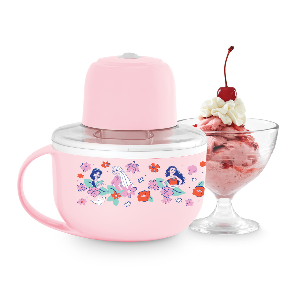 Pink mug-style ice cream maker with colorful floral and character illustrations, shown with lid and a glass bowl of strawberr