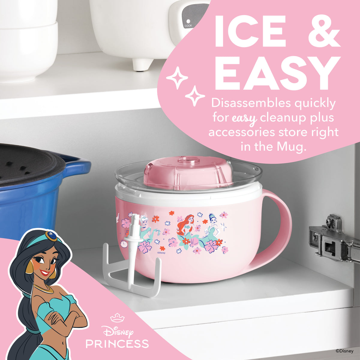 Pink mug-shaped ice cream maker with Disney Princess graphics and detachable lid, displayed on shelf with accessories.