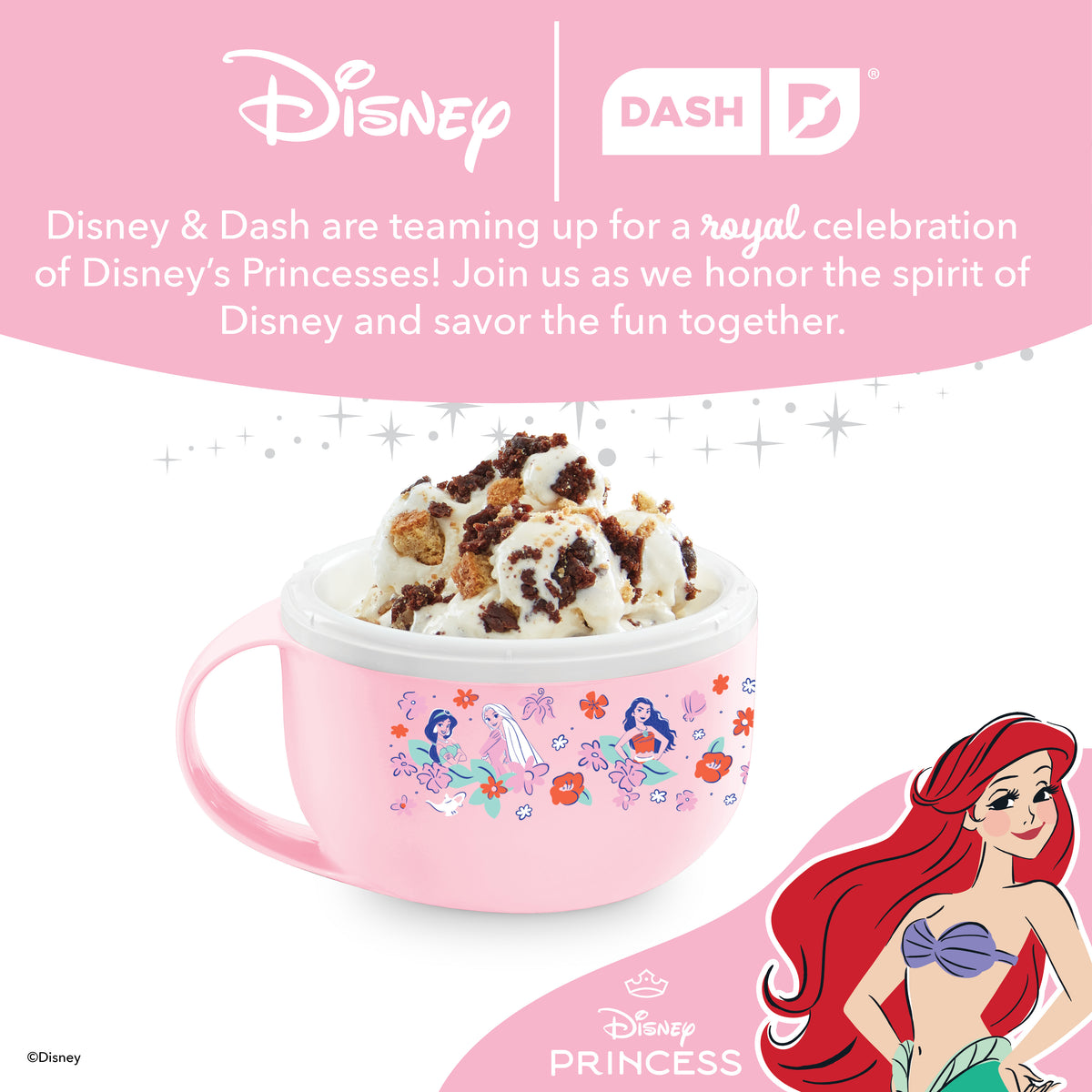 Pink mug-shaped ice cream maker with Disney Princess characters and colorful floral designs, filled with ice cream and toppin