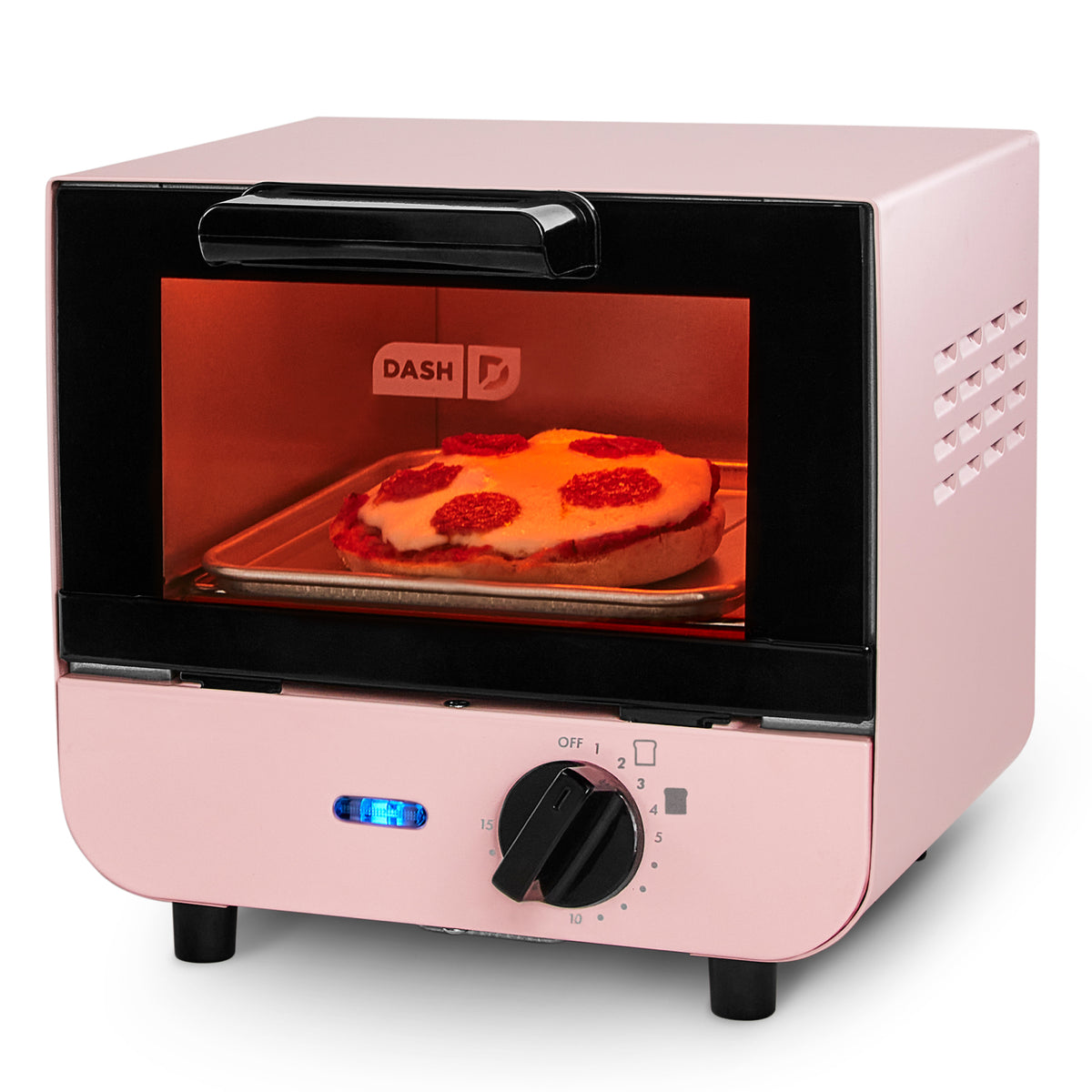 Pink Dash mini toaster oven with black interior, glowing red heating element, and pizza on tray visible through window.