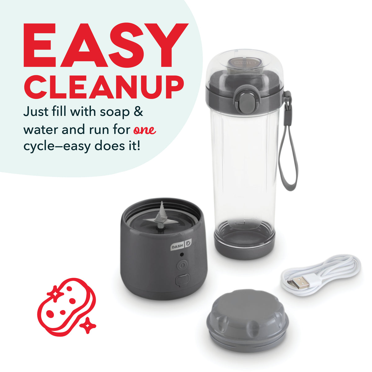 Compact blender with black motor base, clear plastic pitcher, removable lid, charging cable, and gray storage cap.