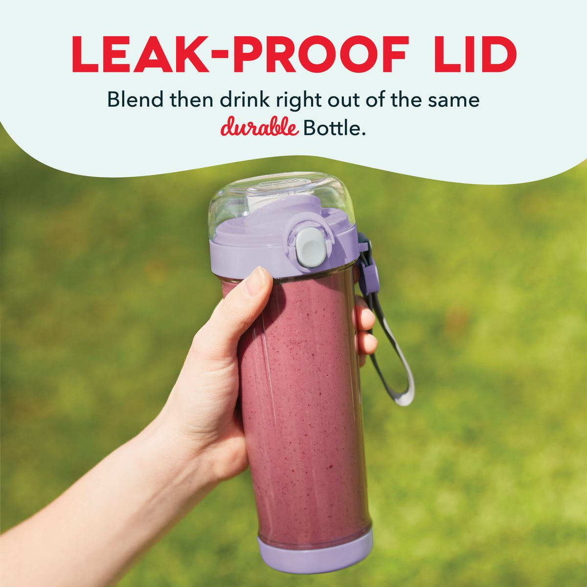 Purple and pink portable blender bottle with leak-proof lid, held in hand outdoors.