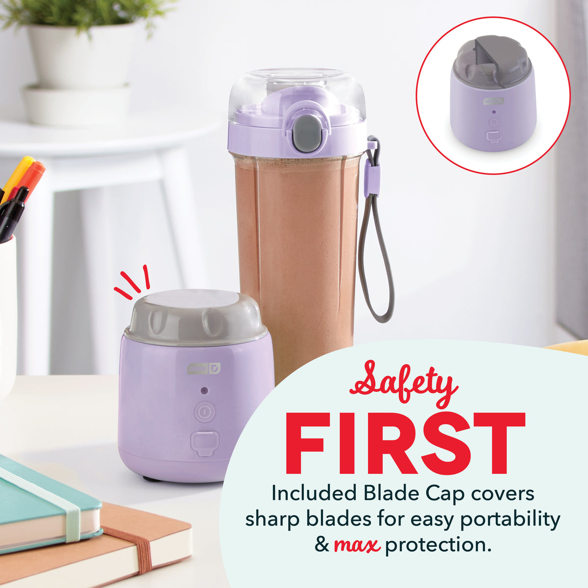 Lavender portable blender with detachable cup, control buttons, and gray blade cap on desk with books and plant.