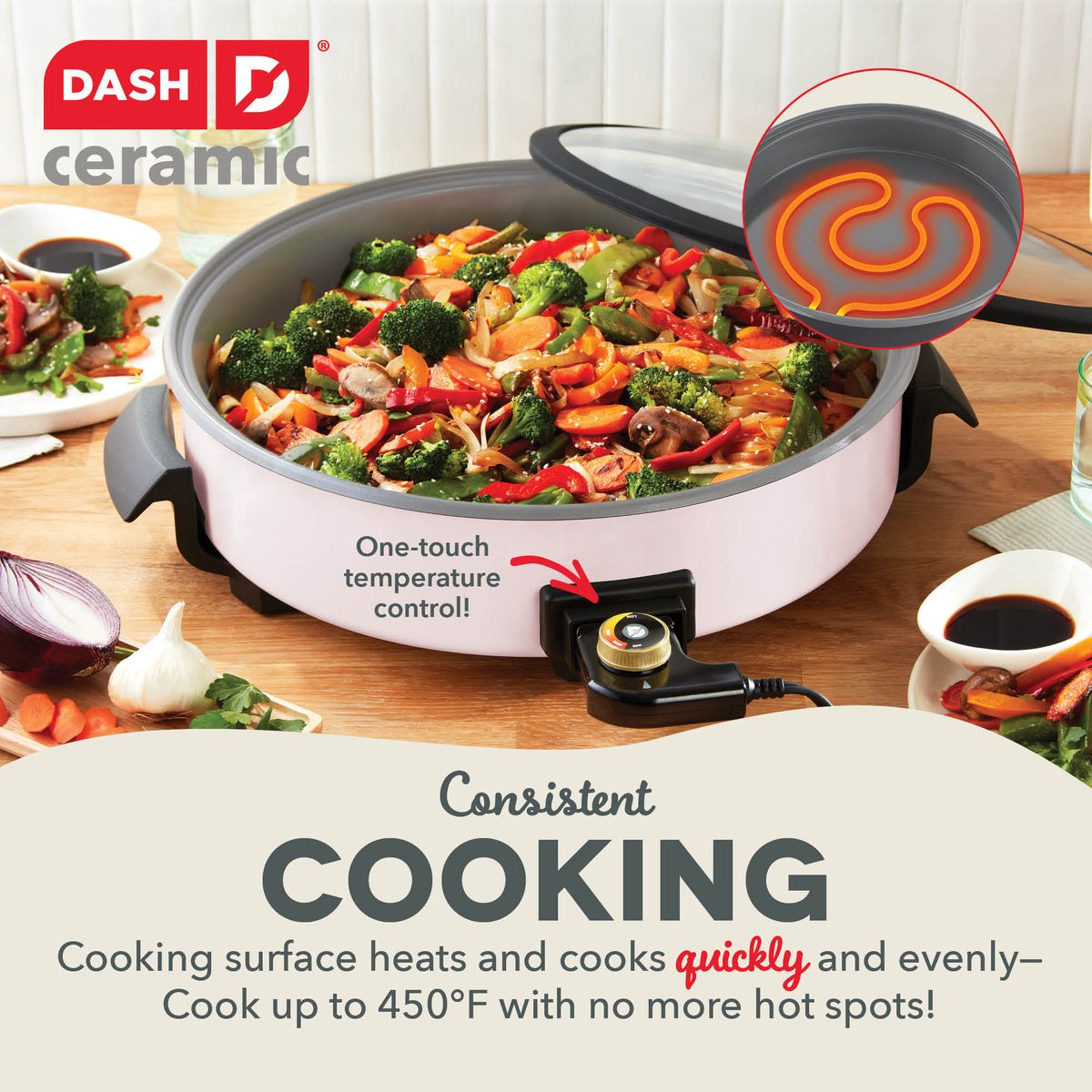 Light pink skillet filled with cooked vegetables, shown with lid and temperature control dial on wooden surface.