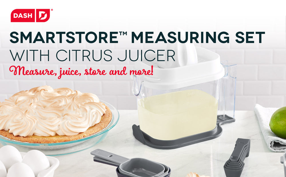 A meringue next to the SmartStore 16 piece measuring set on a counter.