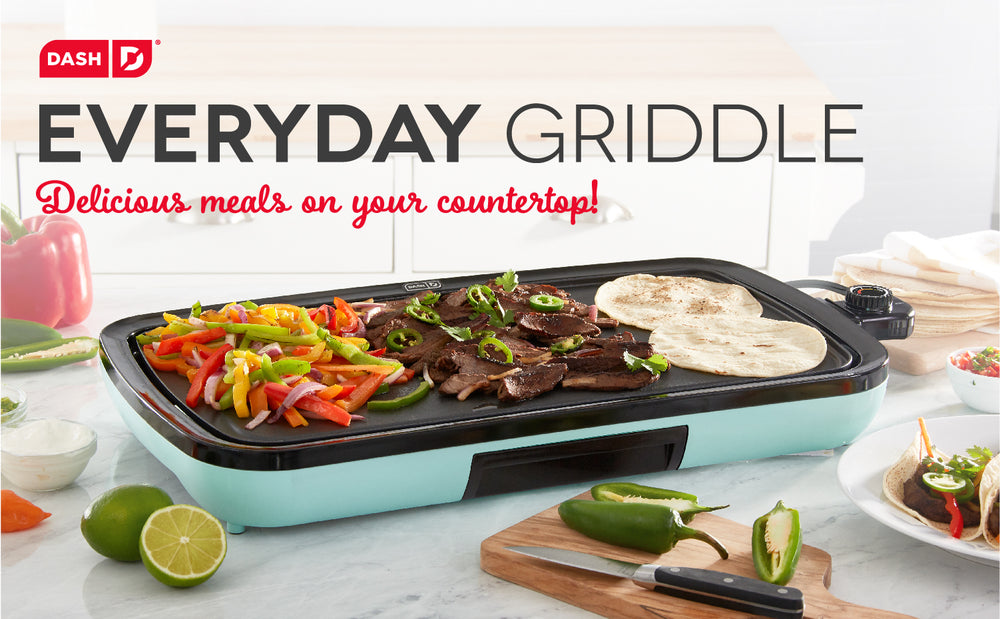 A blue Everyday Griddle cooks all the ingredients for tacos at once like peppers, meat, and tortillas.