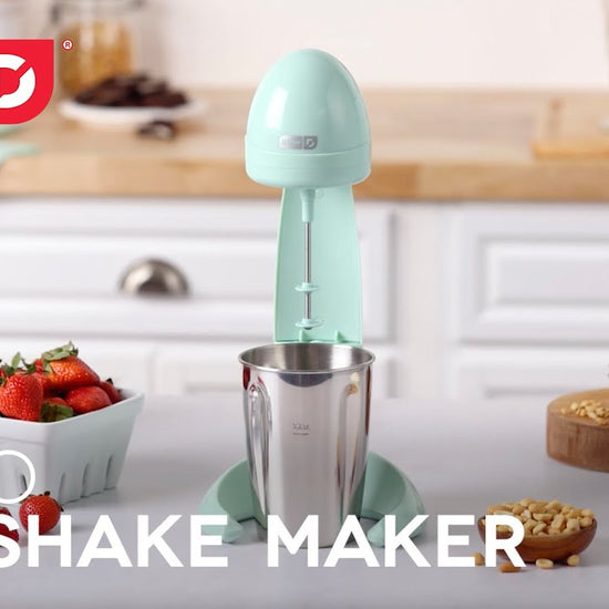 Ice cream, peanut butter, jelly, and milk are added to the milkshake maker and churned, whip creams and toppings are added to the completed milkshake. 