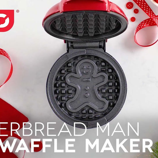 Waffle batter is added to the waffle maker creating a Gingerbread Man printed onto the cooked waffle.