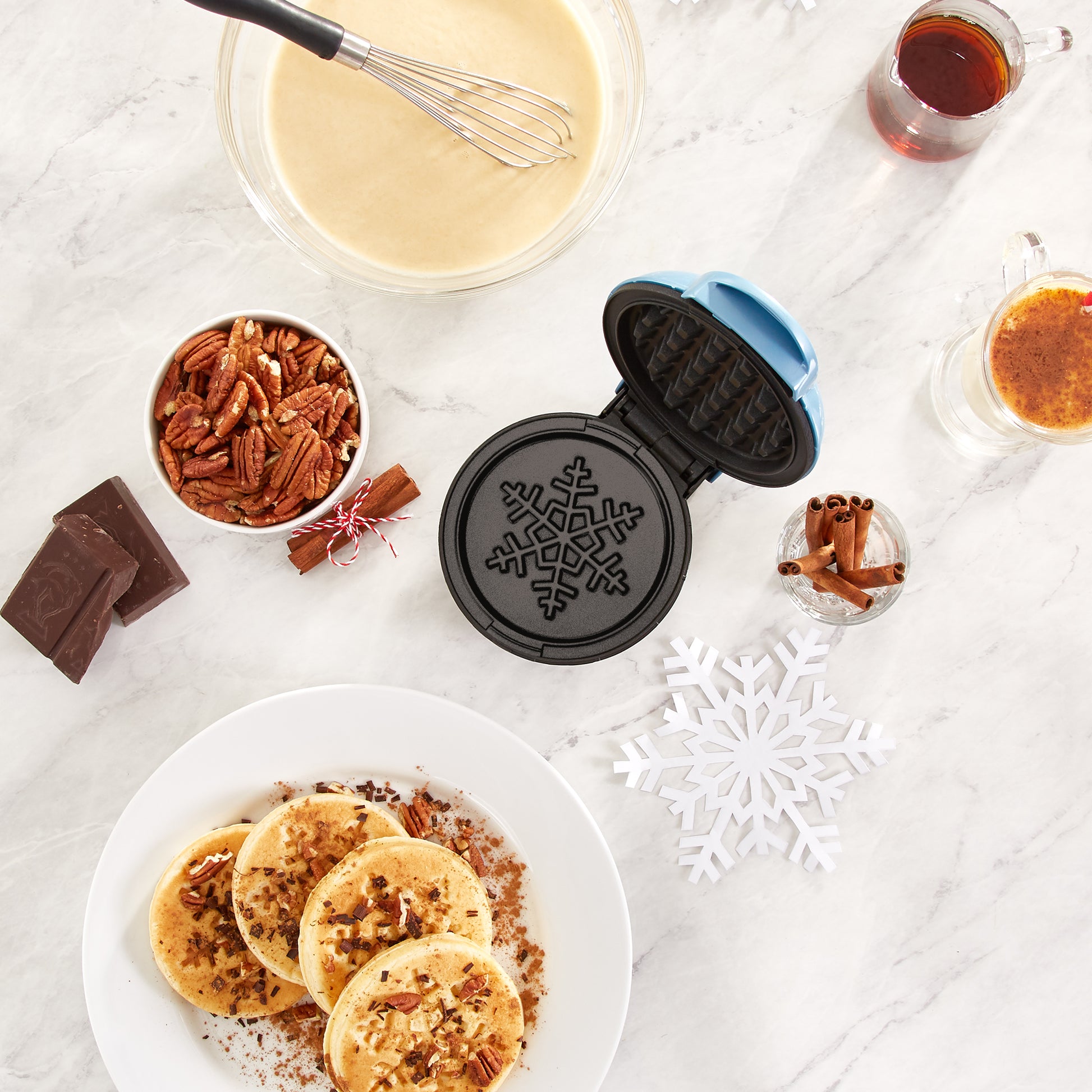 The Dash Snowflake Mini Waffle Maker Makes Breakfast Time Magical