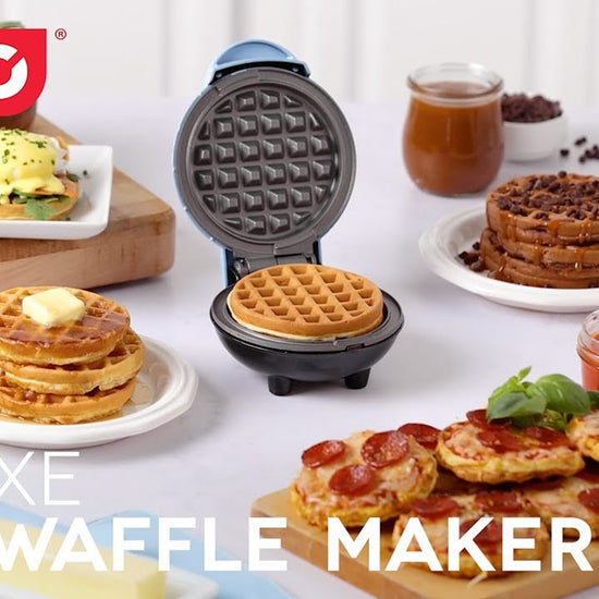 Waffle batter is added to the mini waffle maker and cooked. A waffle is removed from the nonstick surface and topped with syrup. The non stick surfaces is cleaned with the included brush and the cord is wrapped around the cord storage.