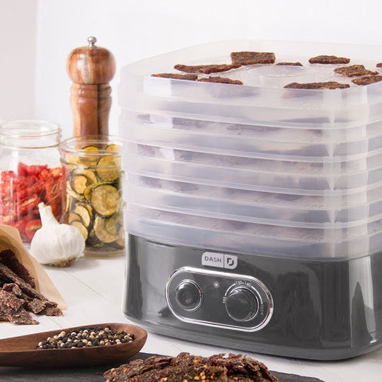 Dried fruits are removed from the dehydrator and added to oatmeal. Dried vegetables are removed from the dehydrator and added to pasta. Slices of dried meat is removed as a jerky snack.
