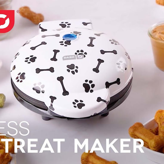 Various batters are added to the maker and baked to make 8 bone shaped dog treats.