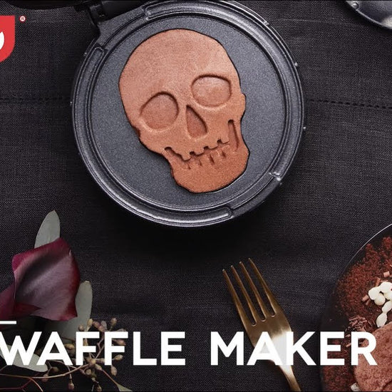 Four inch mini waffles with a skull shape are shown in the mini waffle maker.
