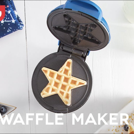 A mini waffle with a star shape is shown in the mini waffle maker.